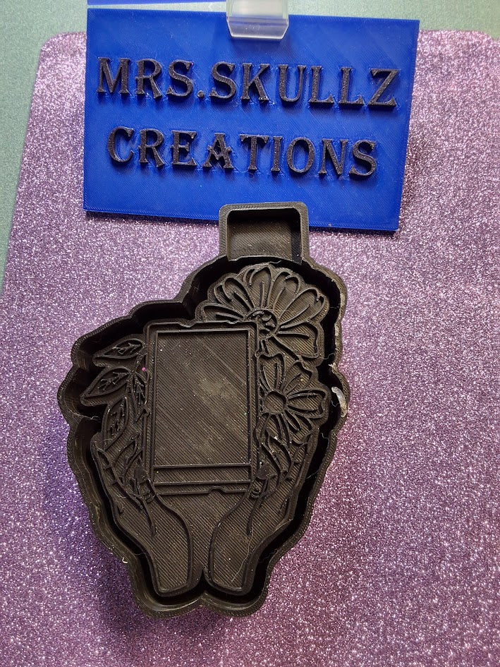 Hands Holding Floral Frame Mold