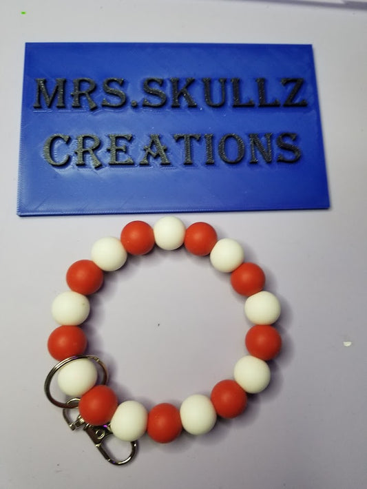 red and white wristlet key ring